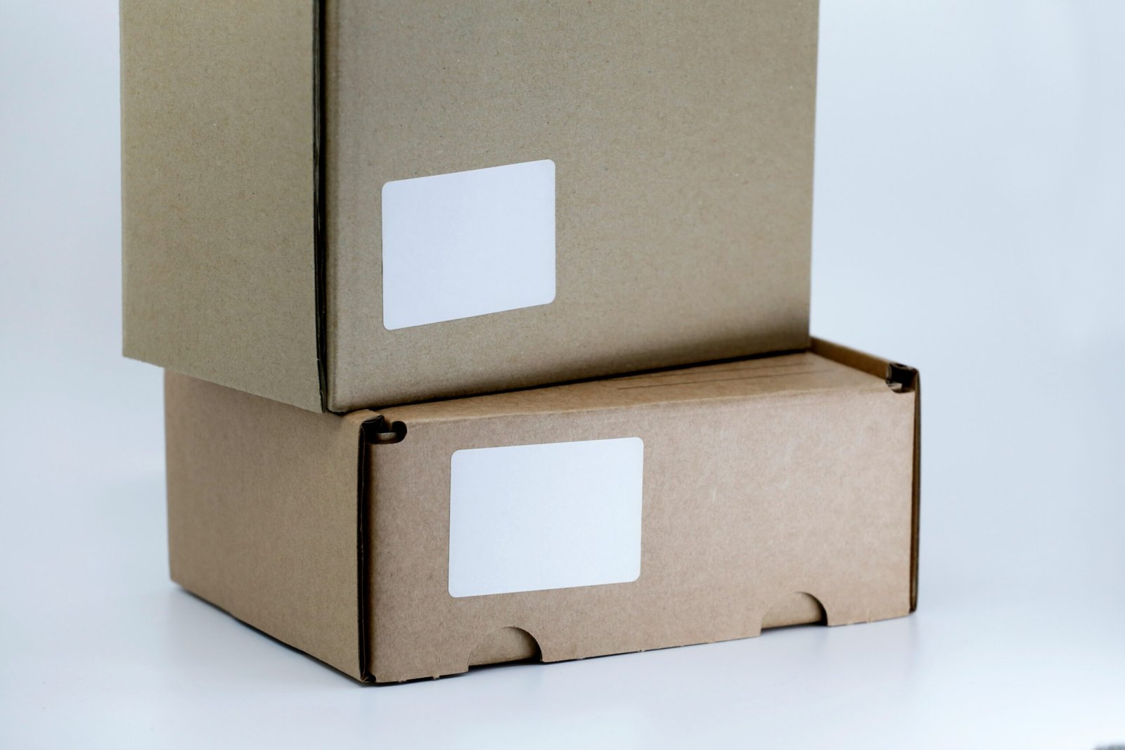 brown cardboard box on white table Dropshipping Side Hustle Guides